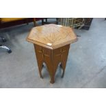 An Arts and Crafts Moorish style inlaid walnut hexagonal occasional table