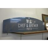 An illuminated Chef & Brewer Pub Co. sign