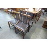 A set of four oak and bergere chairs