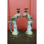 A pair of French style porcelain and ormolu mounted figural parrot candlesticks