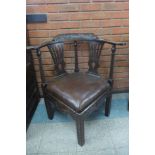 A Victorian carved oak corner chair