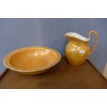 An orange lustre wash jug and bowl