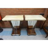 A pair of Art Deco style simulated rosewood and faux marble topped console tables
