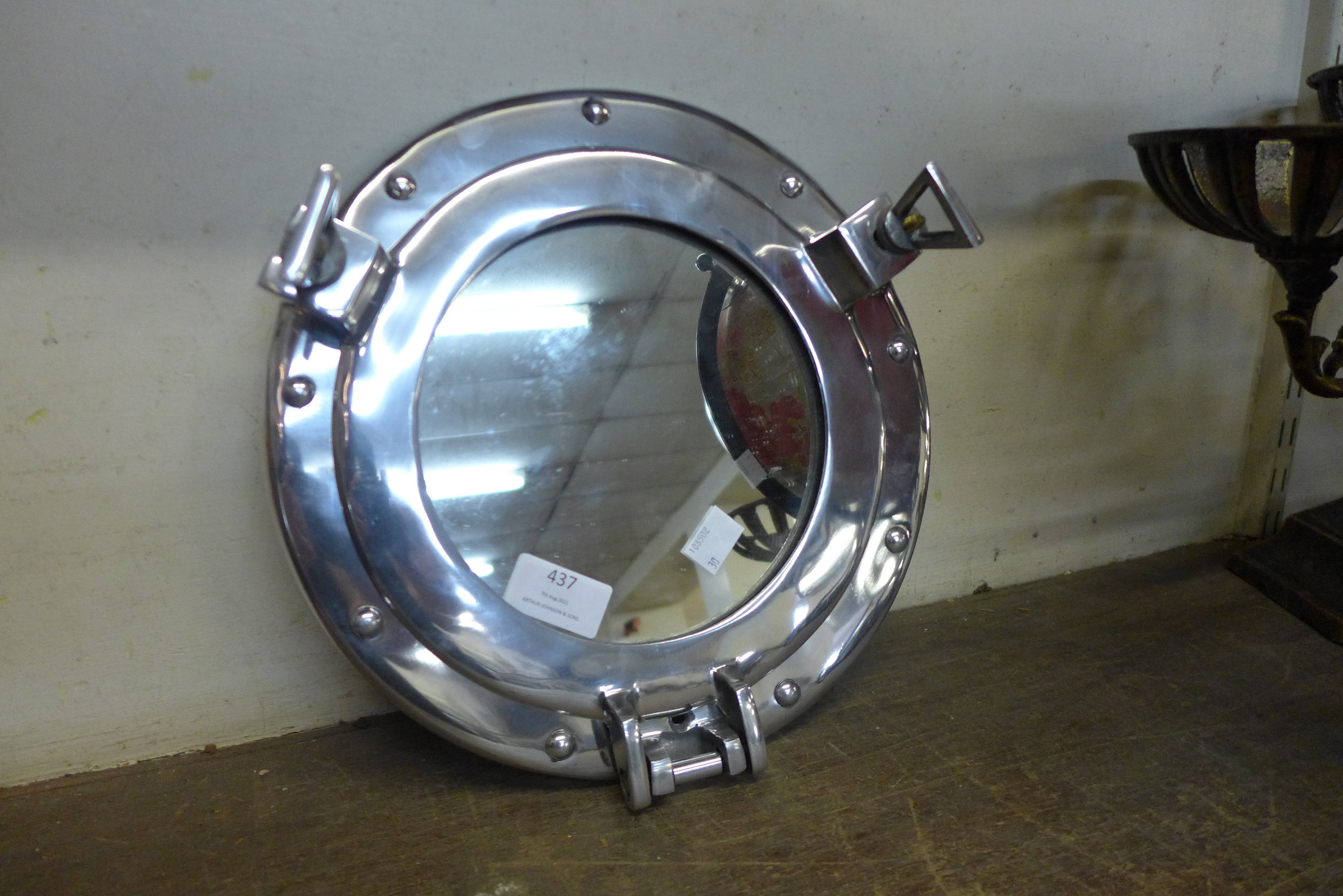 A port hole style mirror