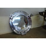 A port hole style mirror