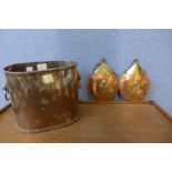 A plated ice bucket and two brass and copper plaques