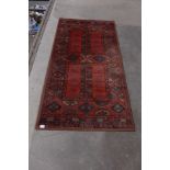 An eastern red ground rug