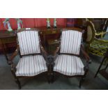 A pair of 19th Century French Empire style mahogany and upholstered fauteuils