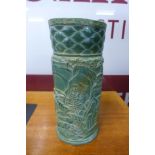 An oriental carved green hardstone brush pot