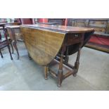 An 18th Century oak drop leaf table