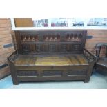 A late 17th/early 18th Century continental carved elm settle