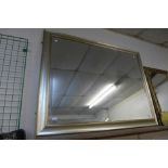 A large silver bevelled mirror