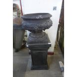 A reproduction neo-classical urn on pedestal