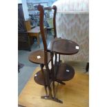 A mahogany folding cake stand