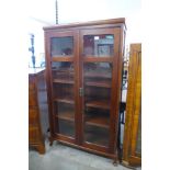 A pitch pine and mahogany two door bookcase