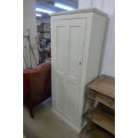 A Victorian painted pine single door cupboard