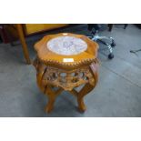 A Chinese carved softwood and marble topped jardiniere stand
