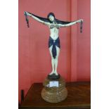 An Art Deco style painted bronze figure of an exotic female dancer, on marble socle