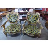 A pair of French Louis XV style gilt wood and fabric and upholstered fauteuils