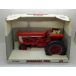 A Farmall 706 die-cast metal tractor by Ertl