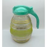 An Art Deco lemonade jug with Bakelite screw top/handle