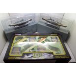 A Corgi Past Times limited edition 100 Years of Flight set, two Atlas Editions model ships, HMS Hood