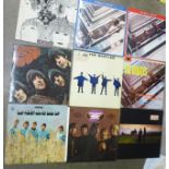 A collection of LP records including The Beatles, etc.