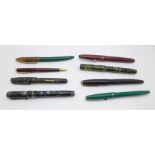 Two pens with 14ct gold nibs, The Conway Stewart and Burnham No.51, five other pens and a pencil,