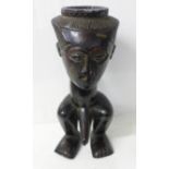 A carved African Kuba palm wine cup