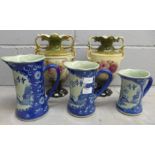 A pair of vases and a set of three jugs **PLEASE NOTE THIS LOT IS NOT ELIGIBLE FOR POSTING AND