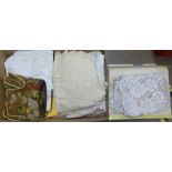 A box of Victorian and later table linen, children's clothing, a woolwork table or mantelpiece