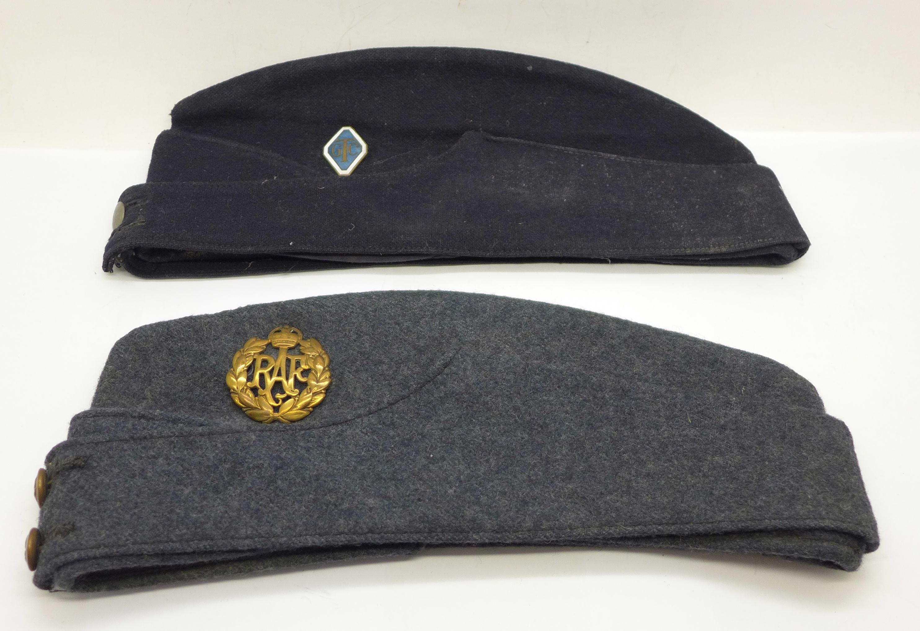 An RAF cap with badge and one other cap