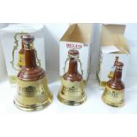 Three graduated Bell's Scotch Whisky bottles with contents