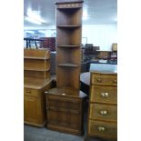 An Ercol Golden Dawn elm and beech freestanding corner cabinet