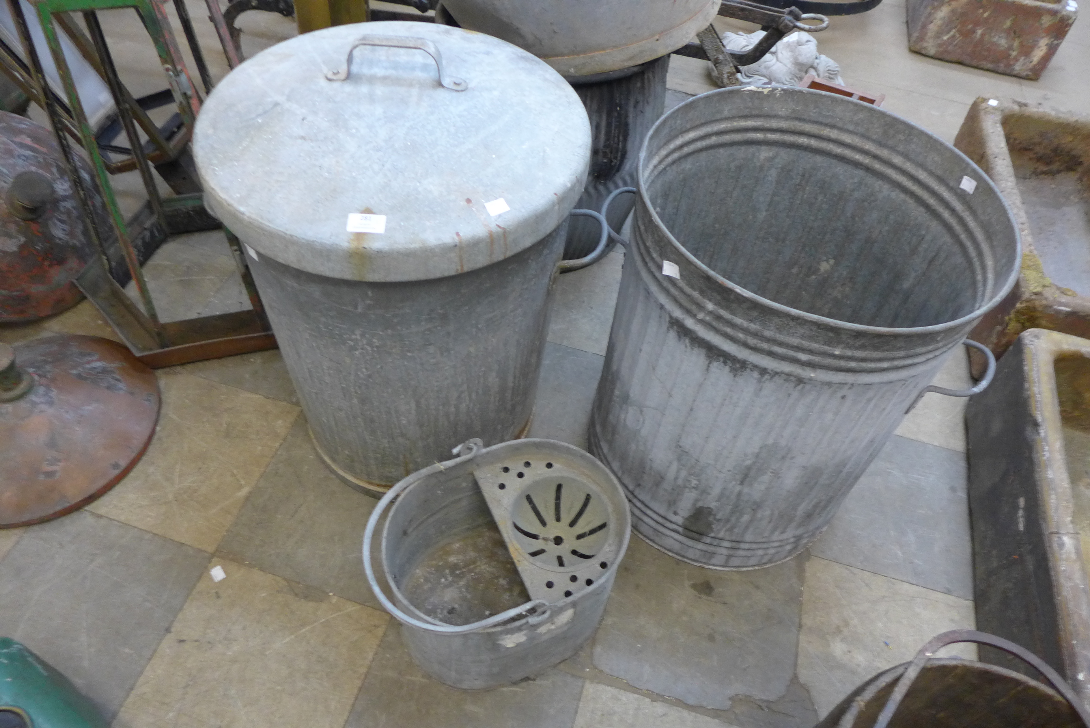 Two galvanised bins and a mop bucket