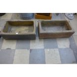 A pair of concrete troughs