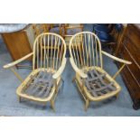 A pair of Ercol Blonde beech Windsor armchairs