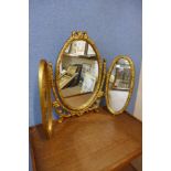 A gilt framed toilet mirror