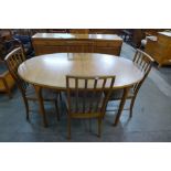 A McIntosh teak extending dining table and four chairs