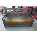 A late 17th/early 18th Century continental carved elm settle