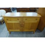 An Ercol Blonde elm and beech sideboard