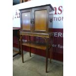 An Edward VII inlaid mahogany cabinet on stand
