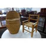 A wicker child's chair and child's beech and rush seated chair