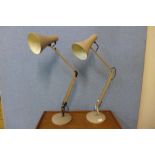 A pair of taupe metal anglepoise desk lamps