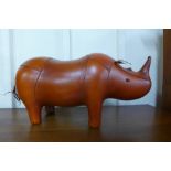 A brown leather rhinoceros stool