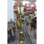 A gilt metal free standing garden lantern