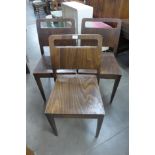 A set of three beech stacking chairs