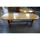 A teak oval coffee table