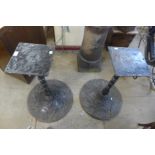 A pair of cast iron pub table bases