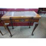 A George II mahogany rectangular fold over tea table